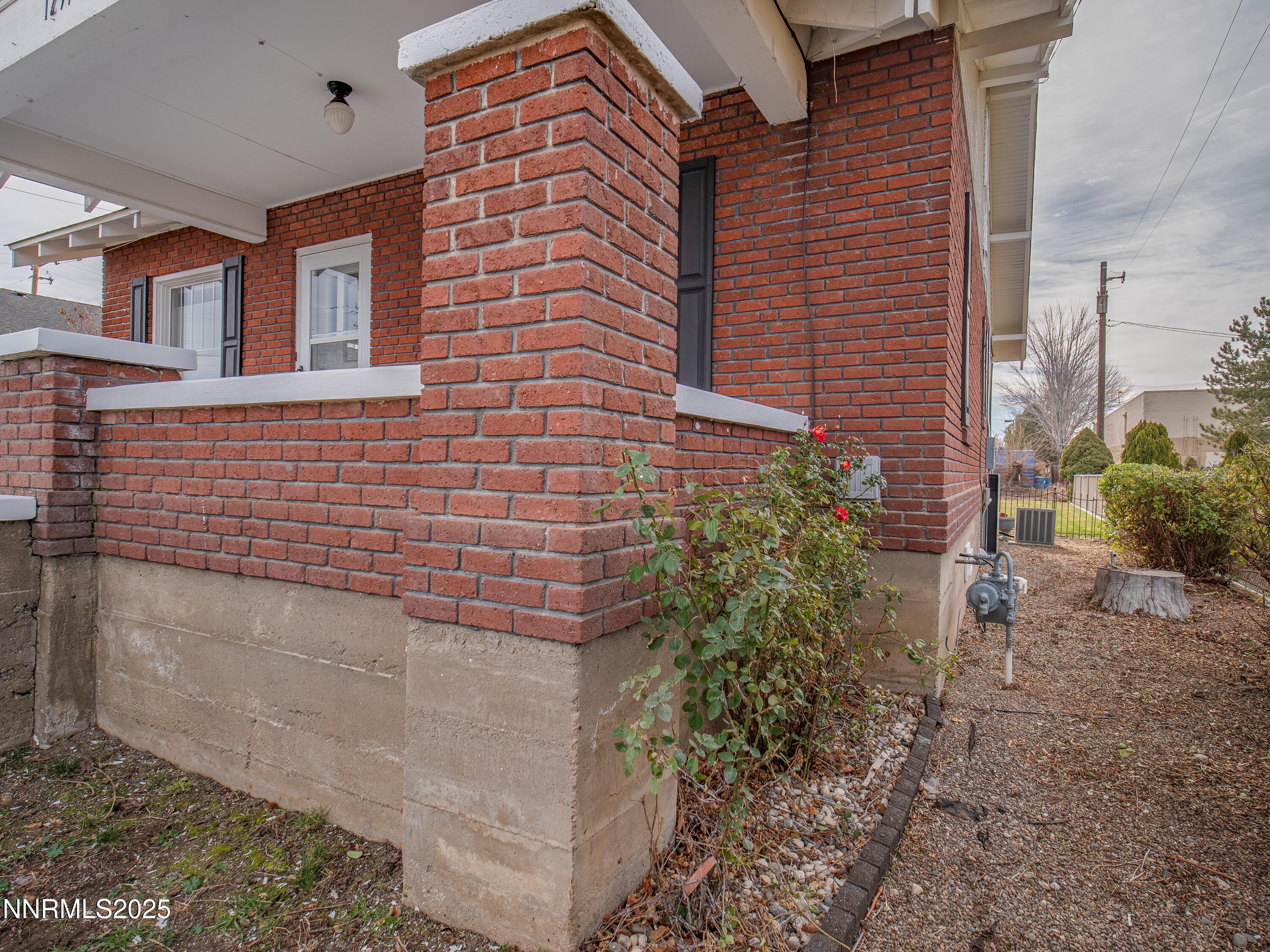 1297 Toler Avenue Gardnerville, NV 89410 - Photo 31 of 31 a brick building with a yard