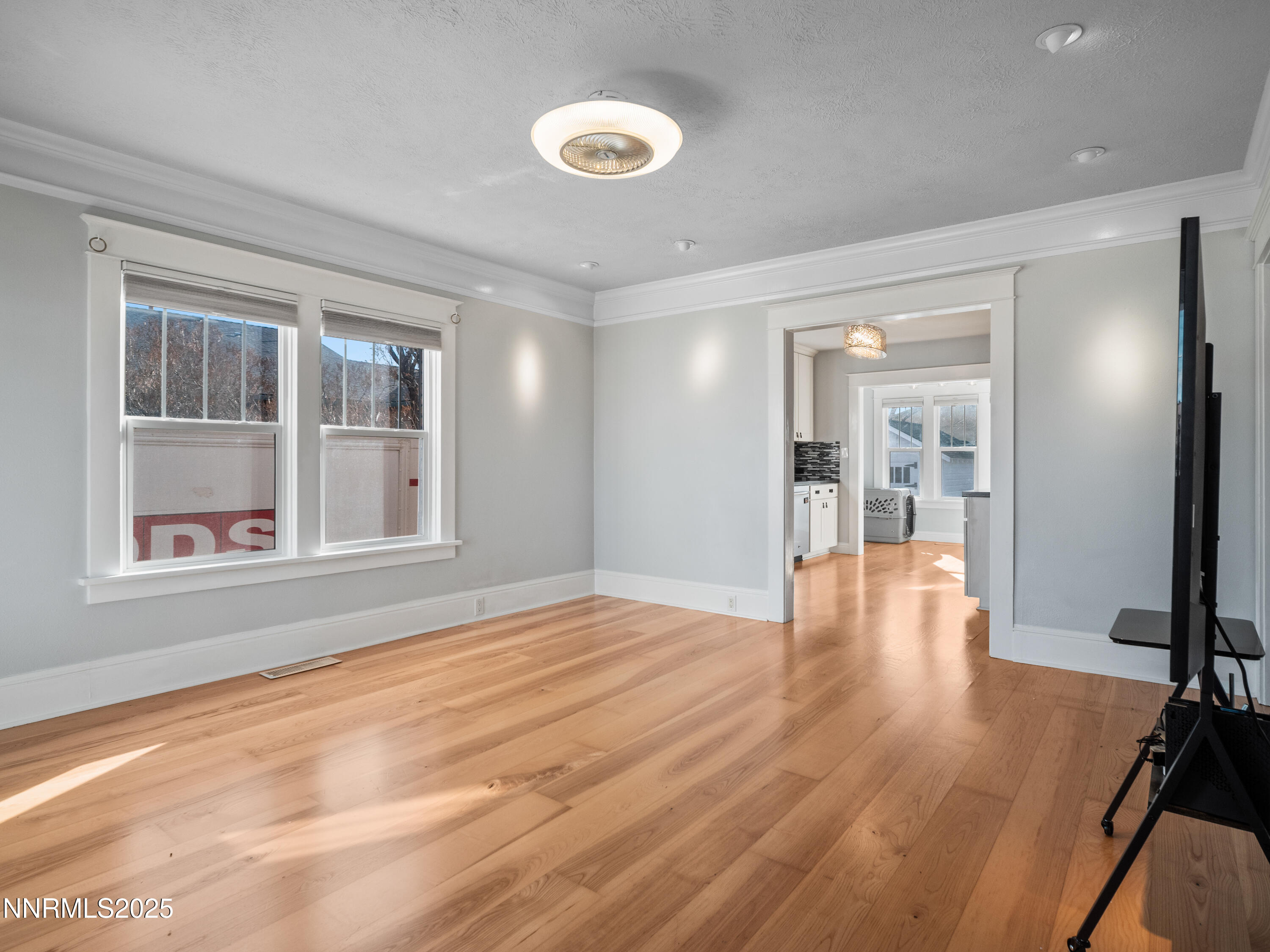 1297 Toler Avenue Gardnerville, NV 89410 - Photo 7 of 31 a view of an empty room with wooden floor and a window