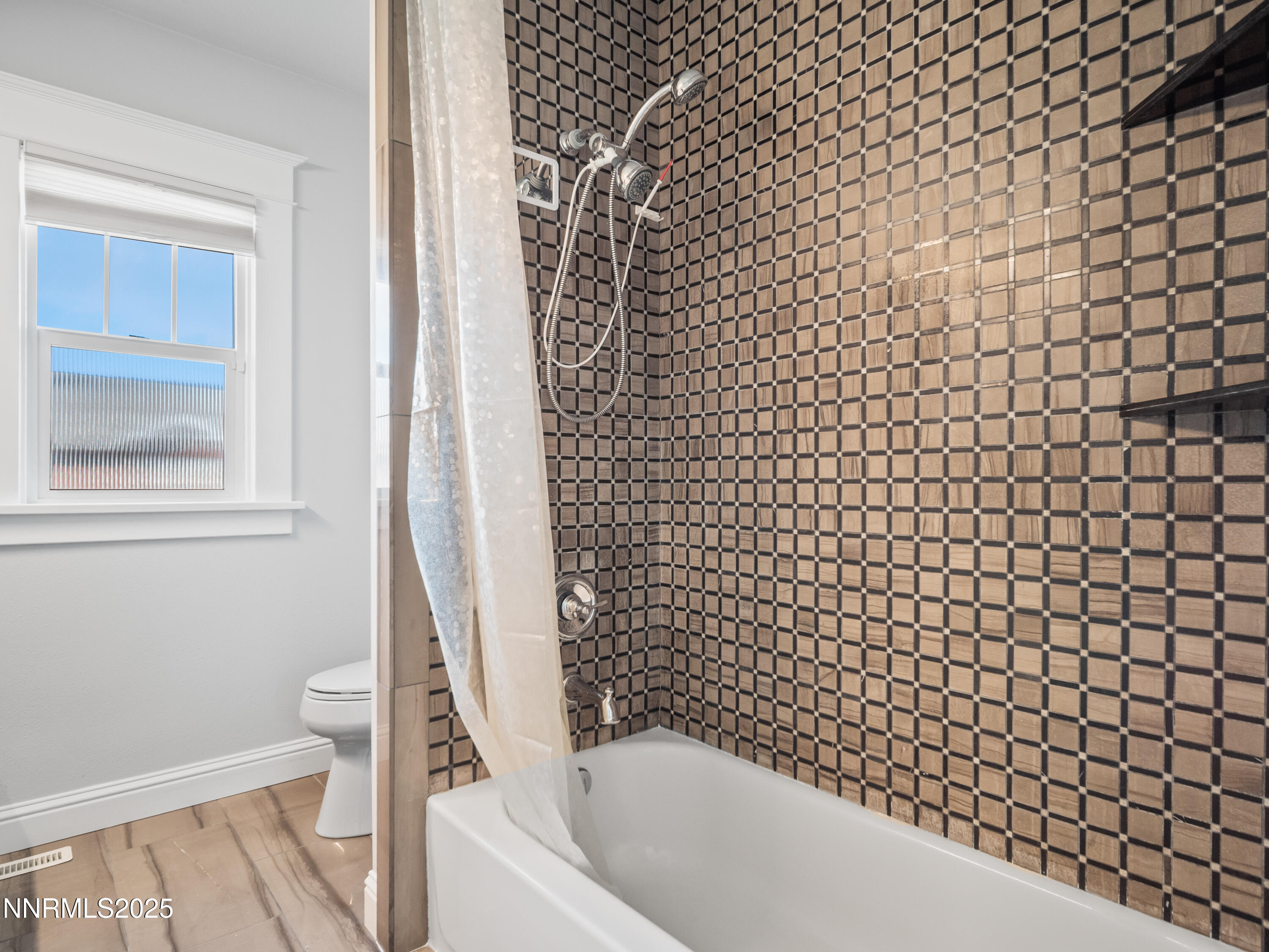 1297 Toler Avenue Gardnerville, NV 89410 - Photo 8 of 31 a bathroom with a bathtub and a shower