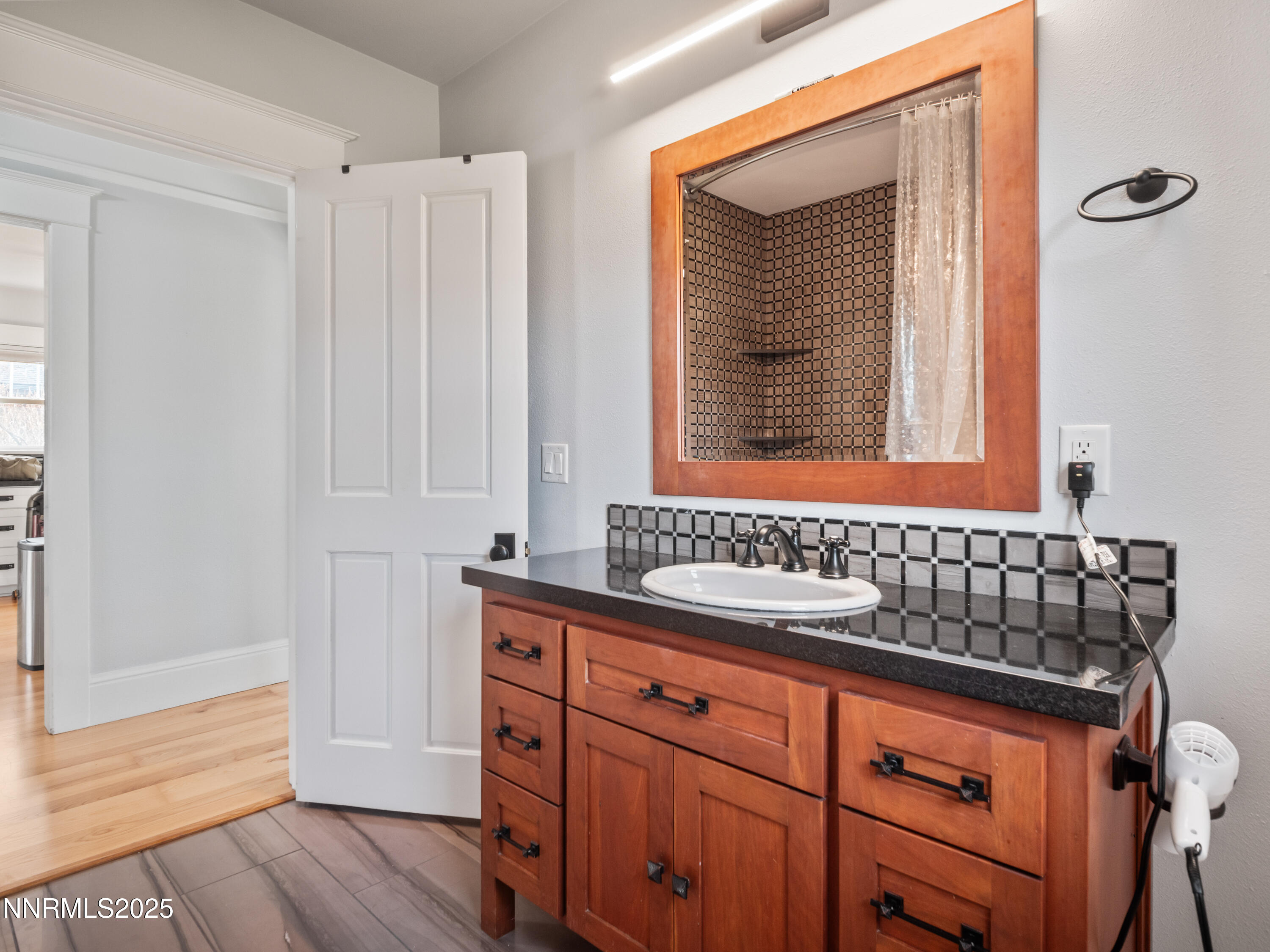 1297 Toler Avenue Gardnerville, NV 89410 - Photo 10 of 31 a bathroom with a sink and a mirror