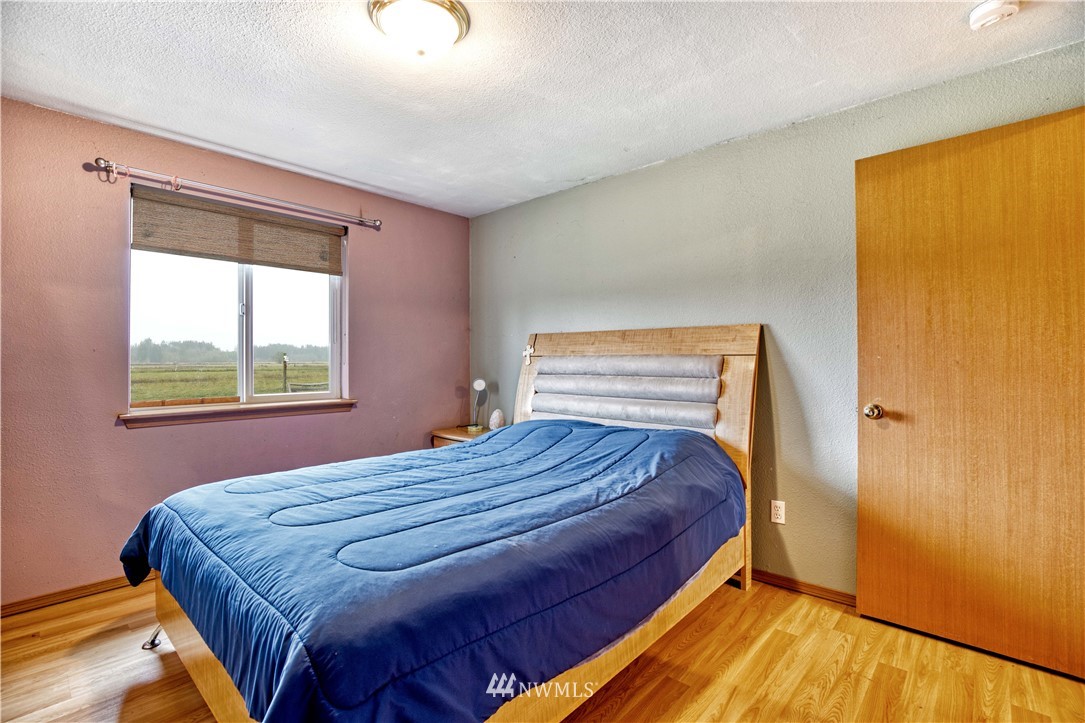 430 Bunker Creek Road Chehalis, WA 98532 - Photo 22 of 30 a bedroom with a bed and window