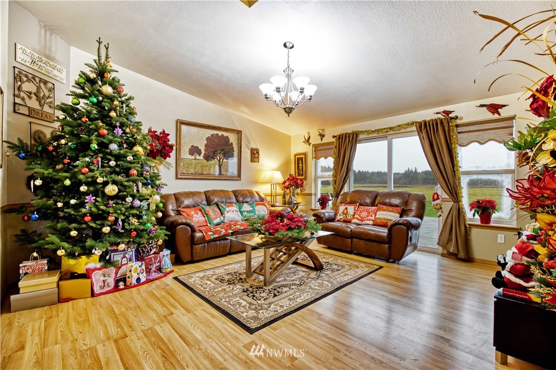 430 Bunker Creek Road Chehalis, WA 98532 - Photo 7 of 30 a living room filled with furniture and a chandelier
