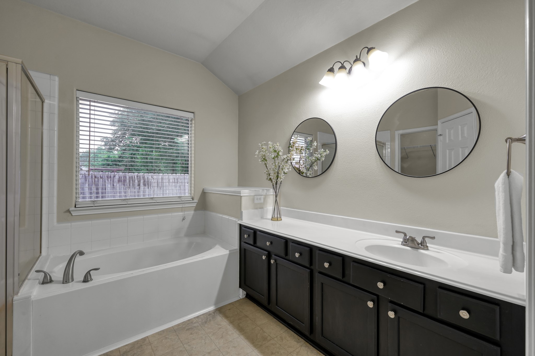 631 Timberstand Lane Spring, TX 77373 - Photo 22 of 38 The primary bathroom offers a relaxing retreat with a soaking tub, separate shower, and spacious vanity area.