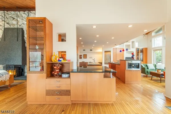 a living room with furniture and kitchen view