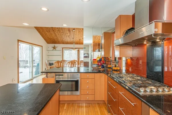 a kitchen with stainless steel appliances granite countertop a stove and a sink