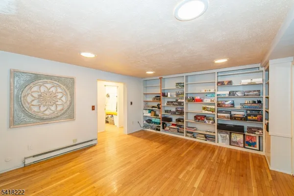 a room with furniture and a wooden floor
