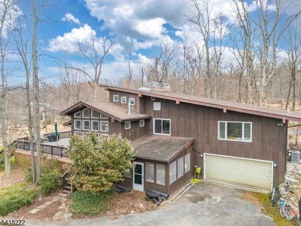 a view of a yard with large trees