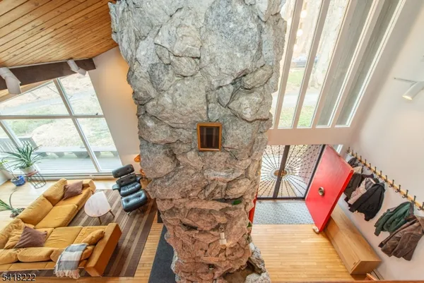 a balcony with couch and wooden floor