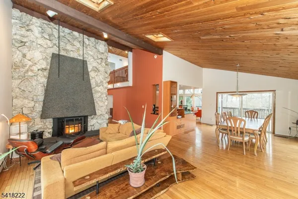 a view of a patio with table and chairs floor to ceiling window with wooden floor