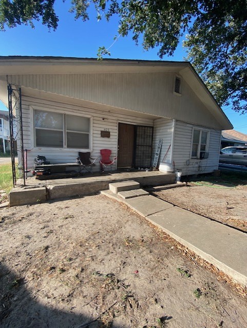 409 Chaparral Street Alice, TX 78332 - Photo 10 of 24 a front view of a house with a yard