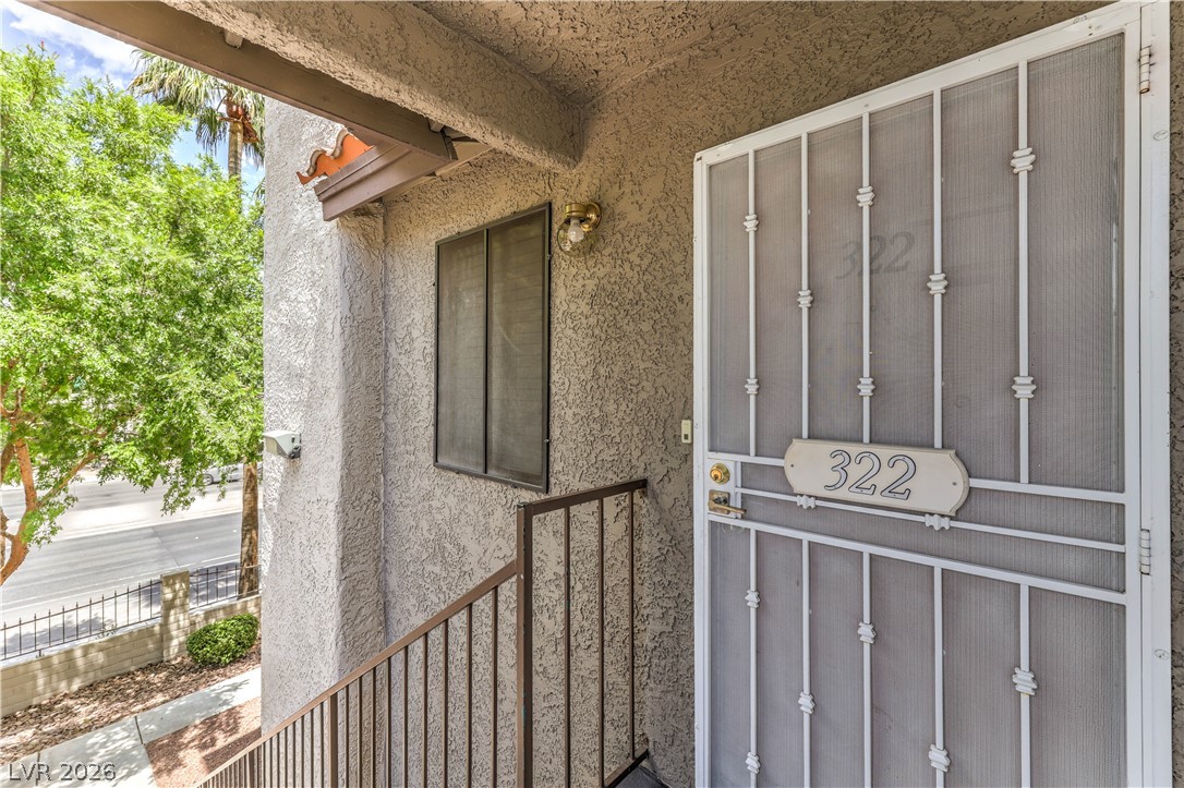 1575 West Warm Springs Road, Unit 322 Henderson, NV 89014 - Photo 3 of 25 This inviting entry features durable stucco, offering a warm welcome.