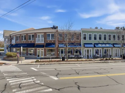 a front view of a building with street view
