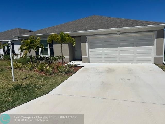787 Southeast 25th Drive Okeechobee, FL 34974 - Photo 1 of 18 a front view of house with yard