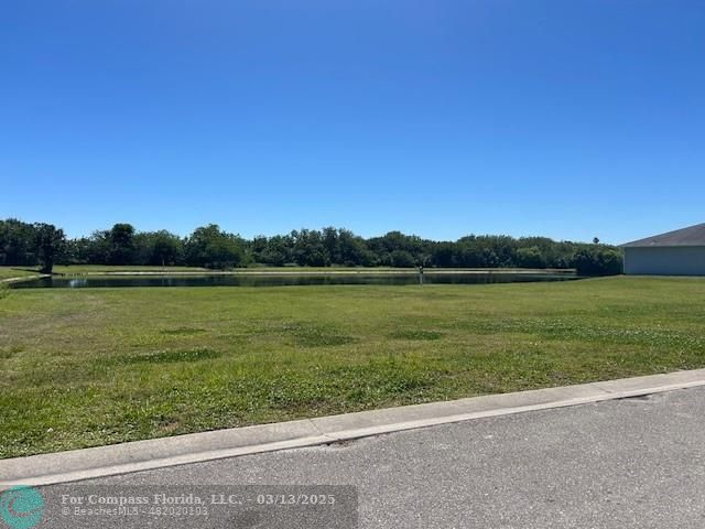 787 Southeast 25th Drive Okeechobee, FL 34974 - Photo 14 of 18 a view of a lake with a big yard