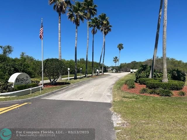 787 Southeast 25th Drive Okeechobee, FL 34974 - Photo 18 of 18 a view of a garden with a slide
