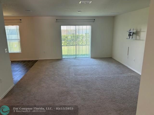 787 Southeast 25th Drive Okeechobee, FL 34974 - Photo 5 of 18 an empty room with windows
