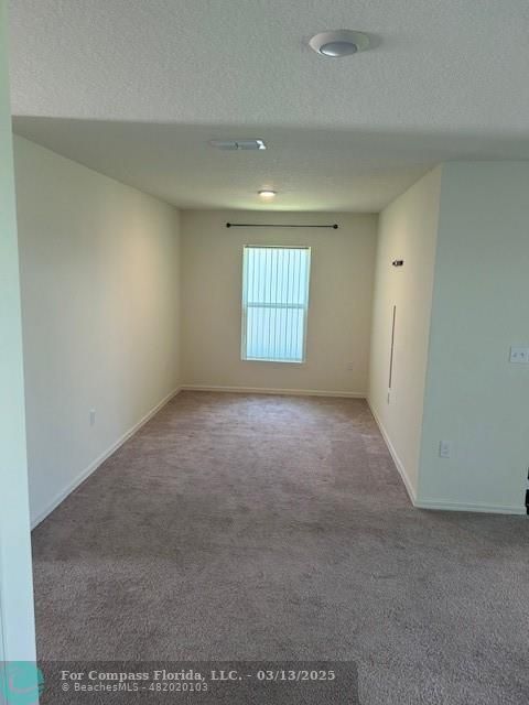 787 Southeast 25th Drive Okeechobee, FL 34974 - Photo 6 of 18 an empty room with windows