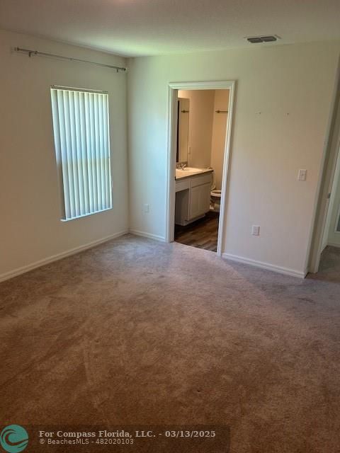 787 Southeast 25th Drive Okeechobee, FL 34974 - Photo 10 of 18 an empty room with windows