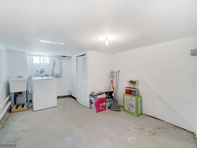 a view of a storage & utility room with a window