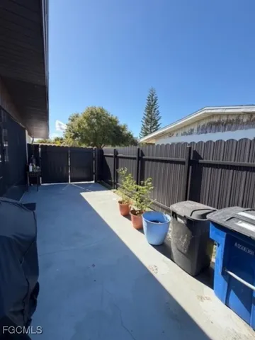 a view of a backyard with sitting area