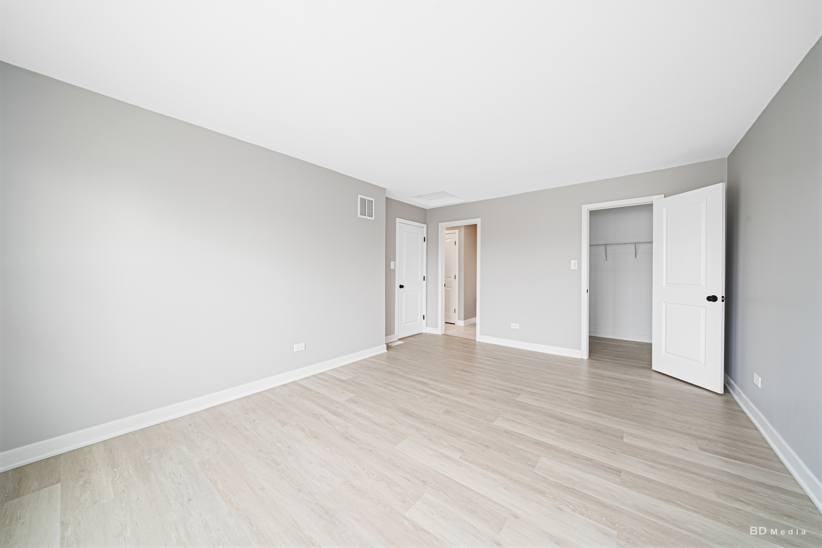 7422 Terrace Drive Justice, IL 60458 - Photo 17 of 23 a view of an empty room with wooden floor and closet