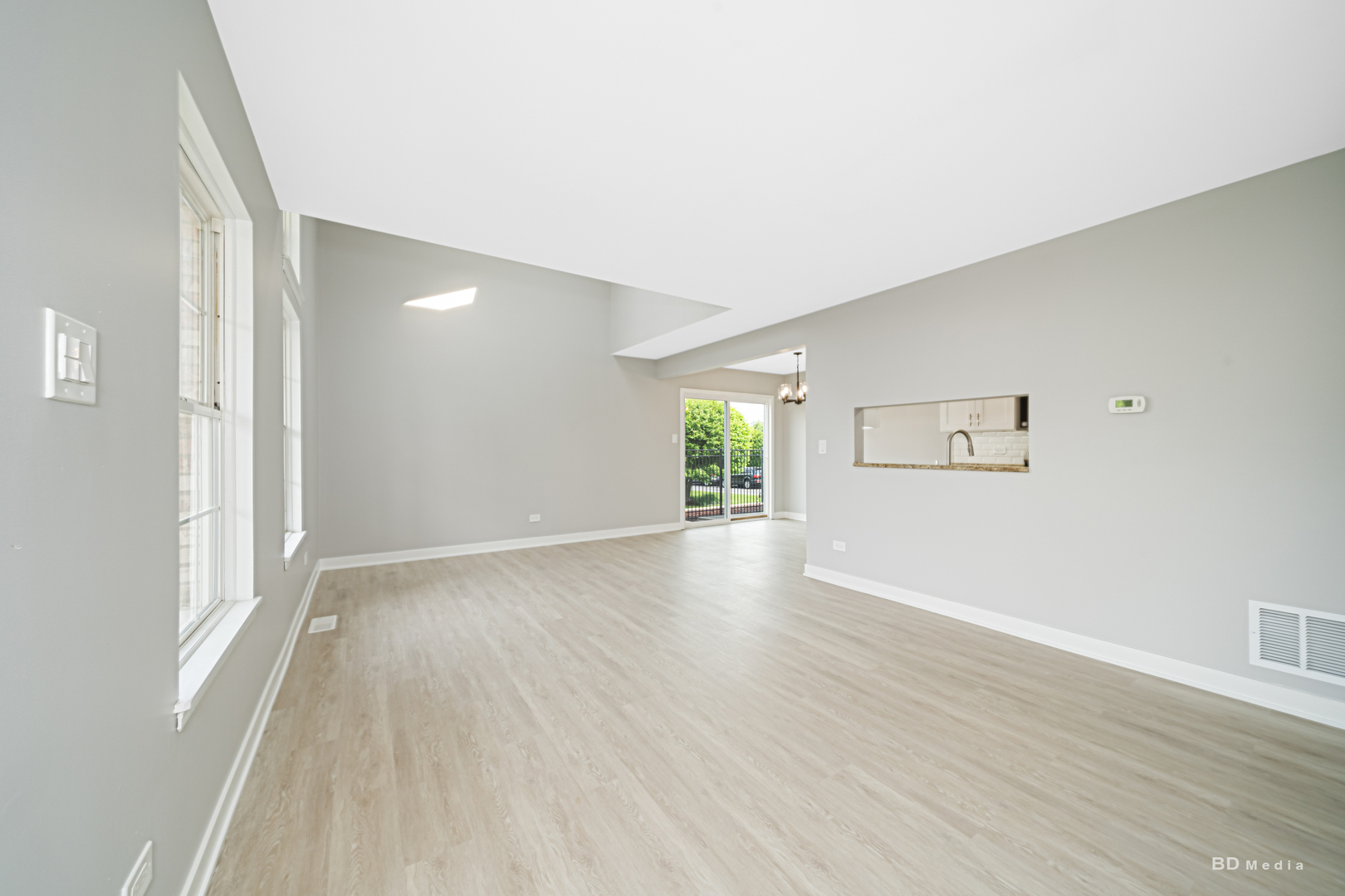 7422 Terrace Drive Justice, IL 60458 - Photo 3 of 23 a view of a room with wooden floor and window