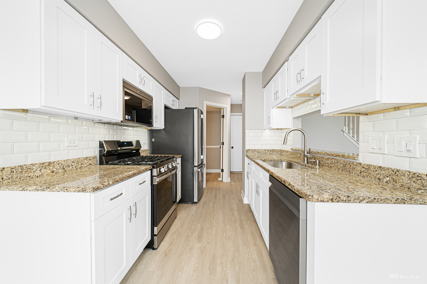 7422 Terrace Drive Justice, IL 60458 - Photo 8 of 23 a kitchen with stainless steel appliances granite countertop a sink stove and refrigerator