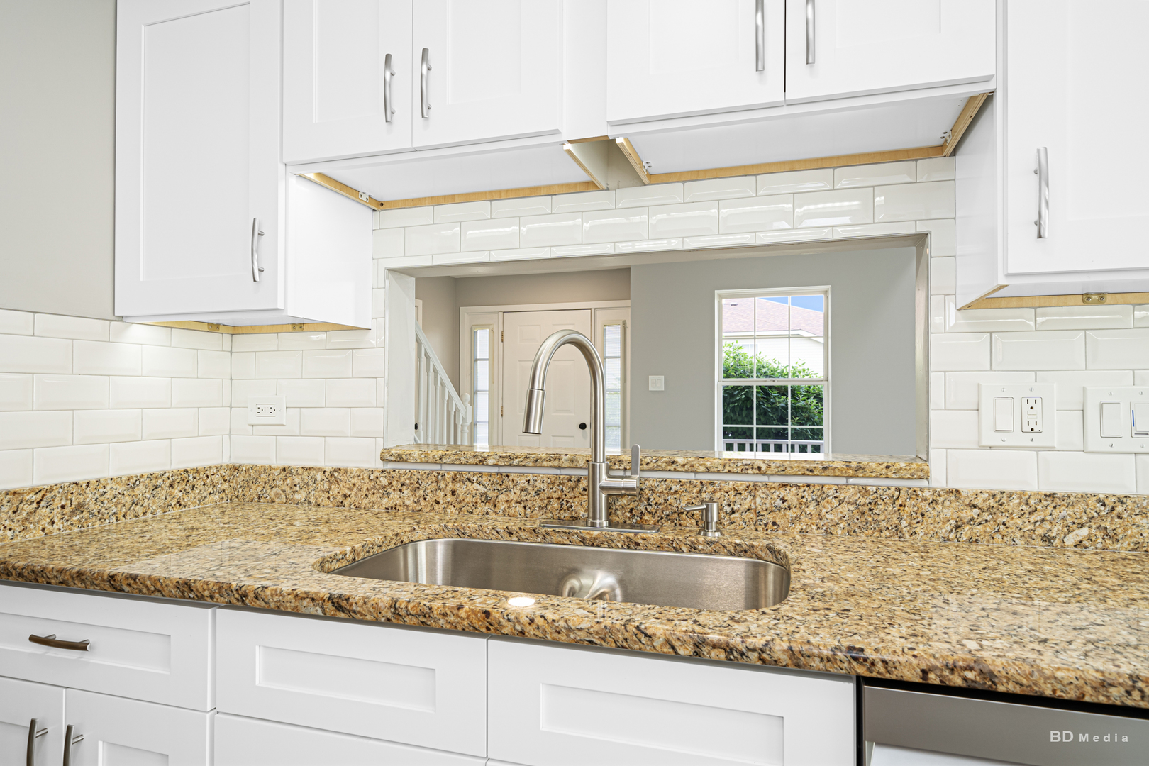 7422 Terrace Drive Justice, IL 60458 - Photo 10 of 23 a kitchen with granite countertop a sink and cabinets