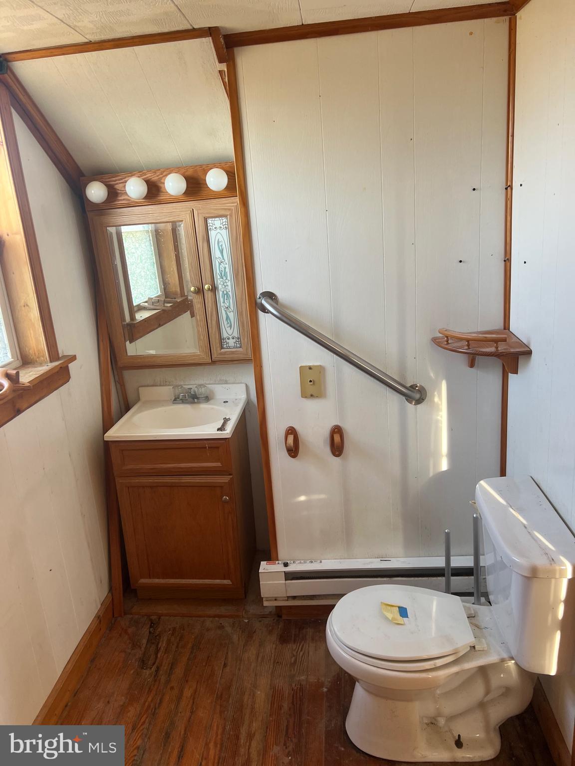 2736 Toddville Road Toddville, MD 21672 - Photo 14 of 44 a bathroom with a sink a toilet and a mirror