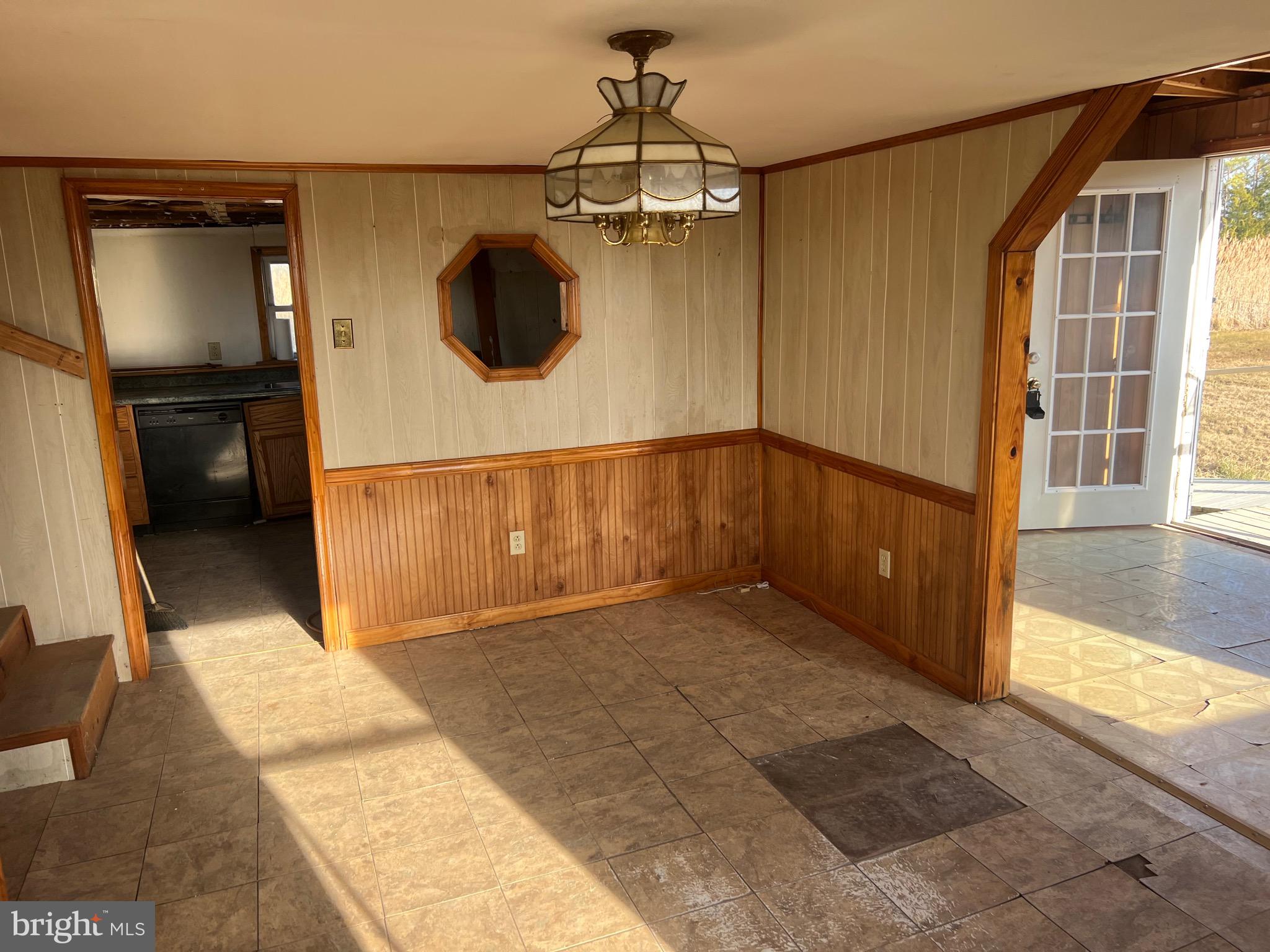 2736 Toddville Road Toddville, MD 21672 - Photo 19 of 44 a view of a hallway with a chandelier