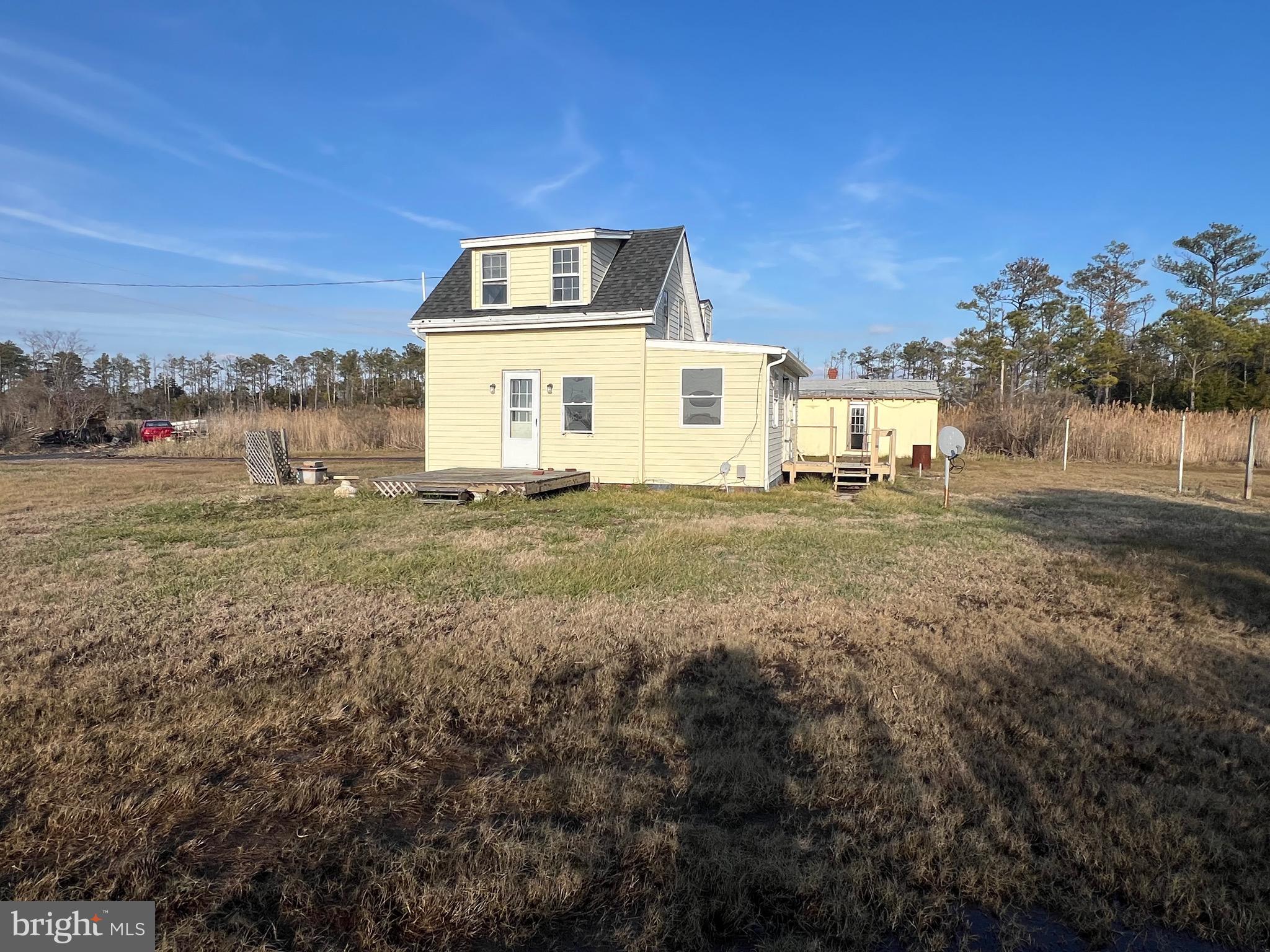 2736 Toddville Road Toddville, MD 21672 - Photo 5 of 44 a big house with lots of trees in the background