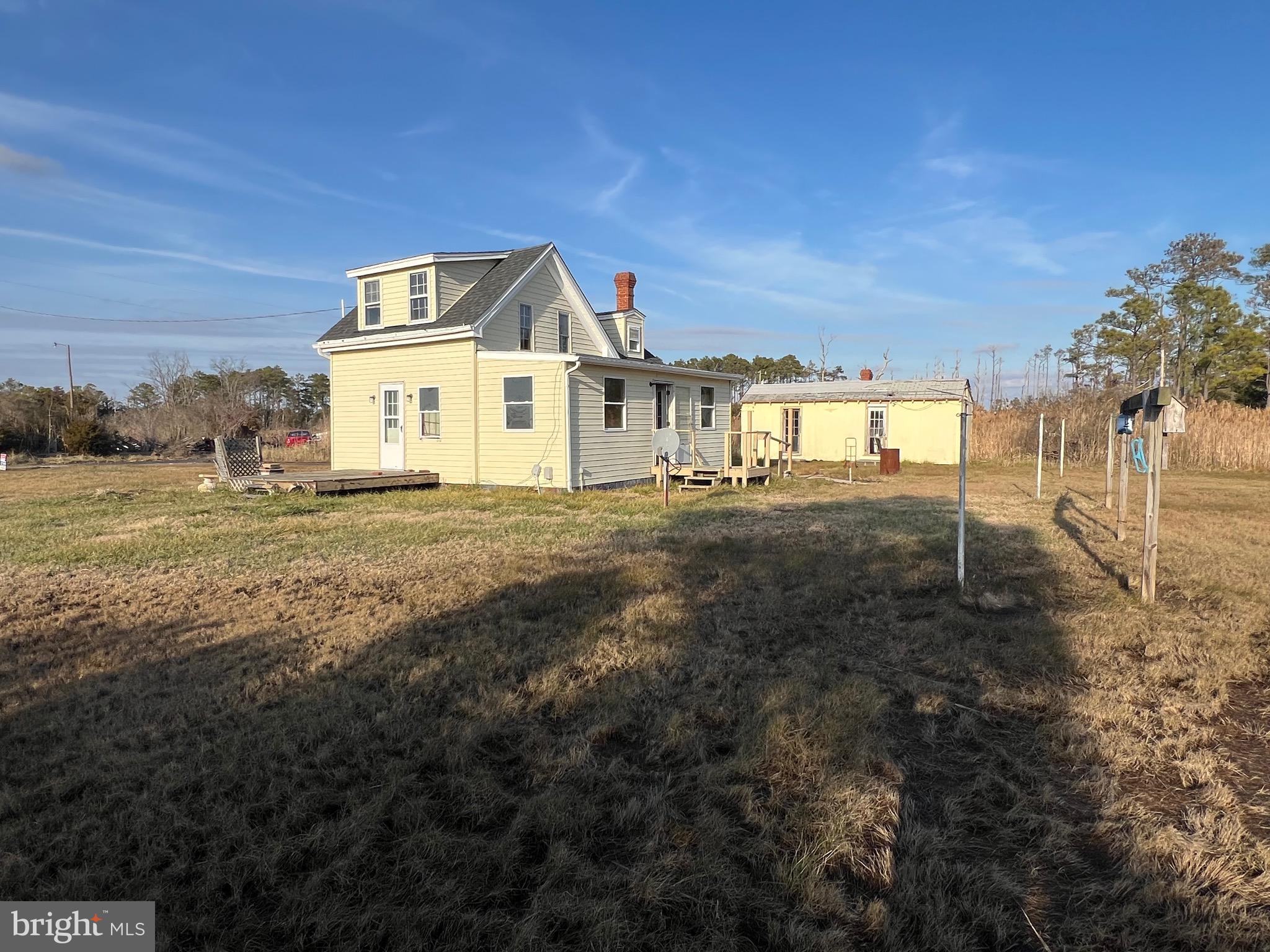 2736 Toddville Road Toddville, MD 21672 - Photo 7 of 44 a front view of a house with a yard