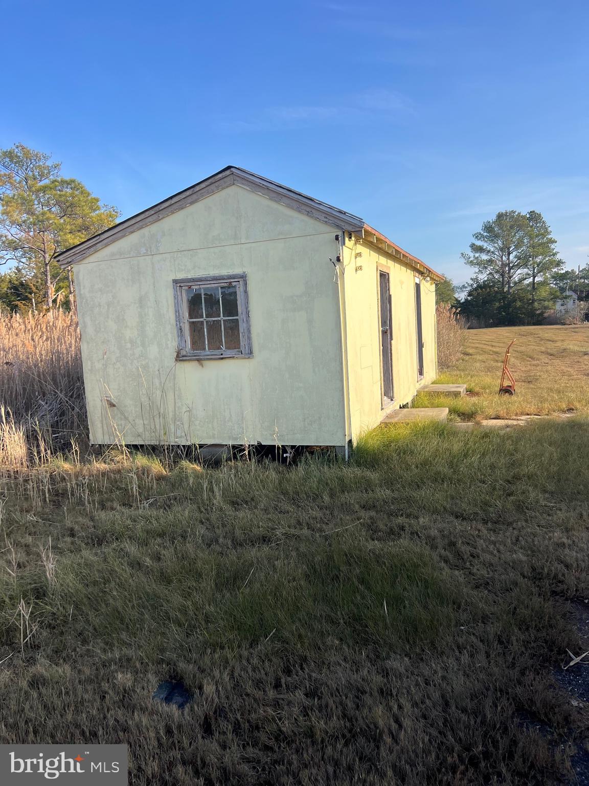2736 Toddville Road Toddville, MD 21672 - Photo 9 of 44 a view of a big house with a yard