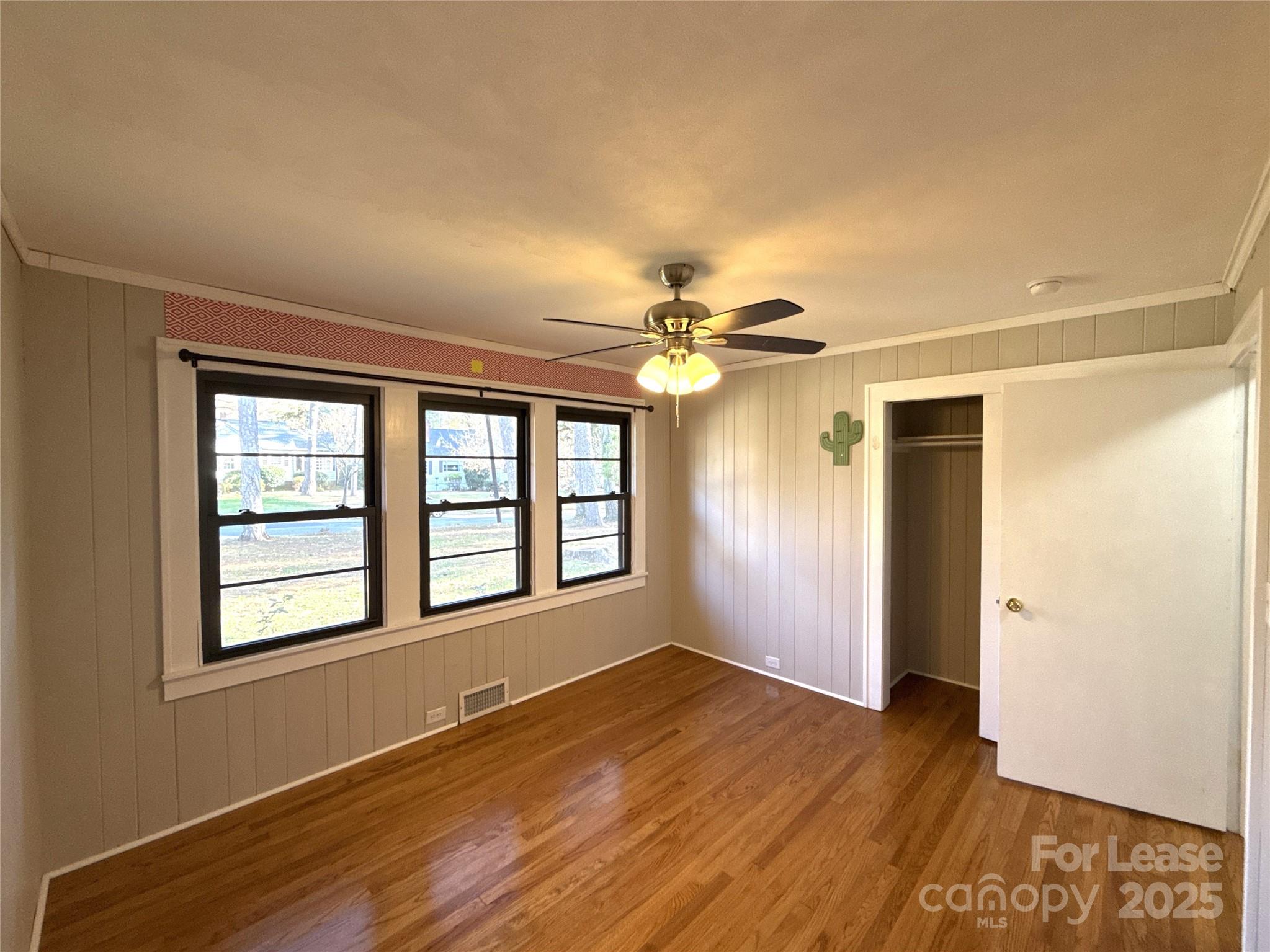 2023 Robin Road Salisbury, NC 28144 - Photo 13 of 17 a view of an empty room with wooden floor and a window