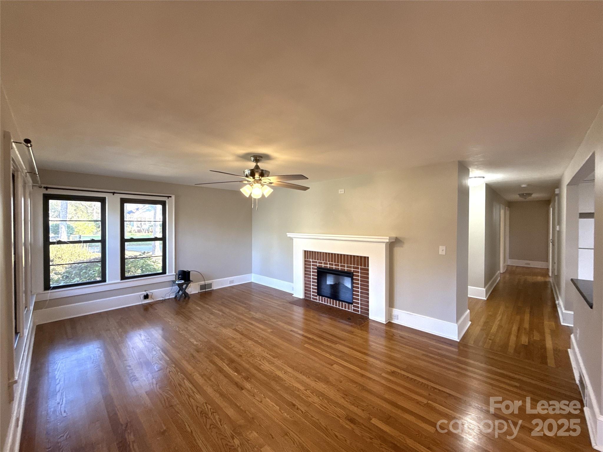 2023 Robin Road Salisbury, NC 28144 - Photo 2 of 17 a view of an empty room with window and wooden floor