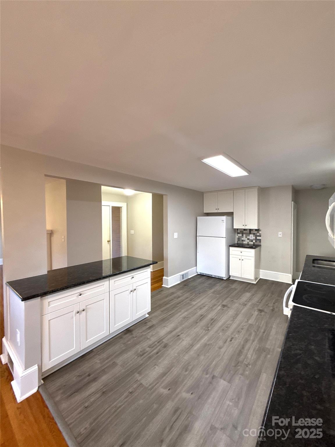 2023 Robin Road Salisbury, NC 28144 - Photo 6 of 17 a large space with a large window and wooden floor