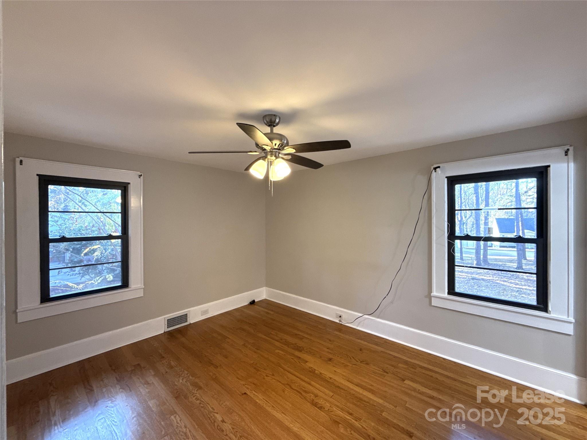 2023 Robin Road Salisbury, NC 28144 - Photo 8 of 17 wooden floor in an empty room with a window