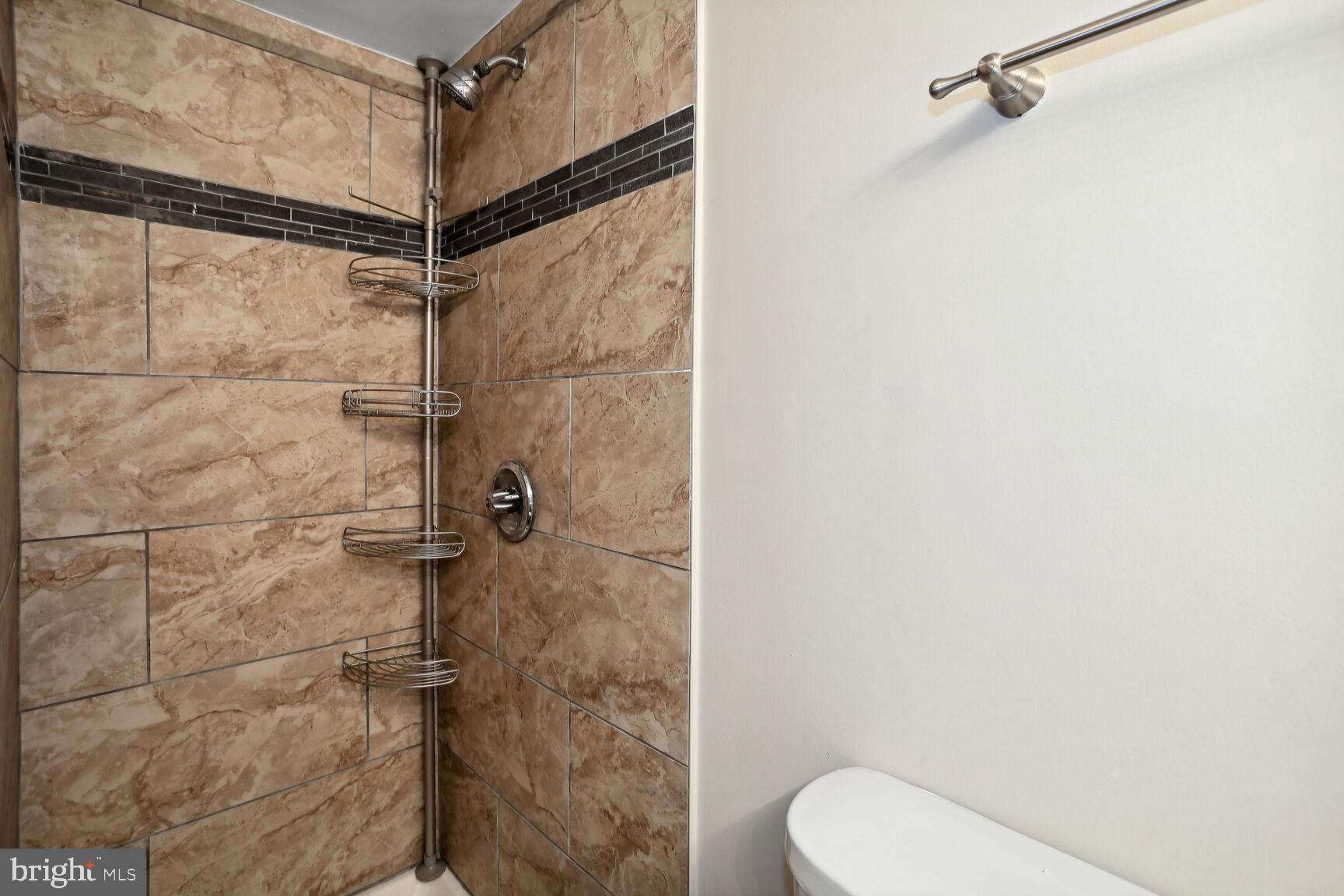 1245 13th Street Northwest, Unit 606 Washington, DC 20005 - Photo 4 of 33 a bathroom with a toilet and a shower