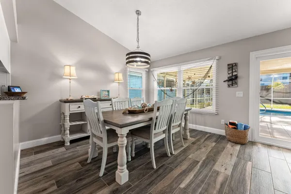 a view of a dining room with furniture window and outside view