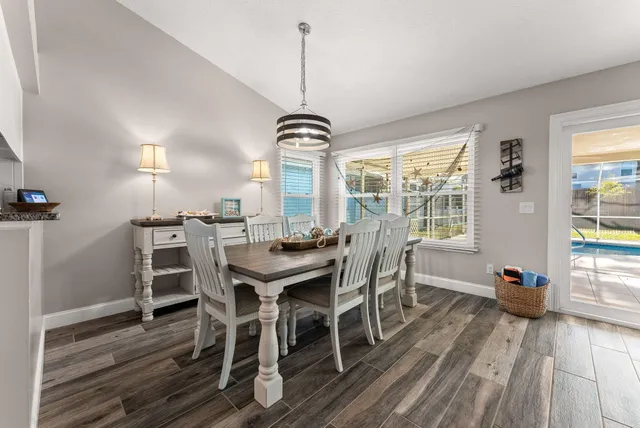 a view of a dining room with furniture window and outside view