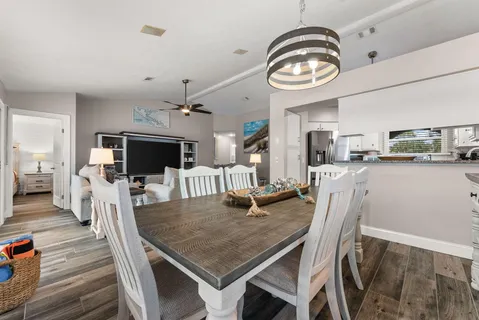 a view of a dining room with furniture and a clock
