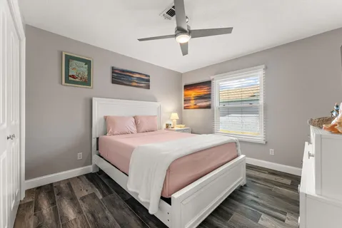 a bed room with a bed and a window