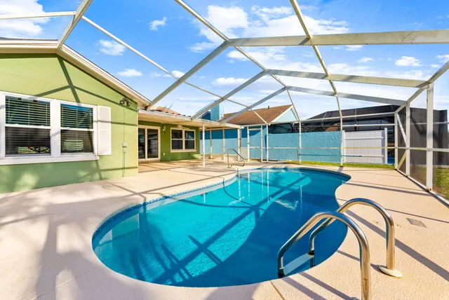a view of a swimming pool with a patio