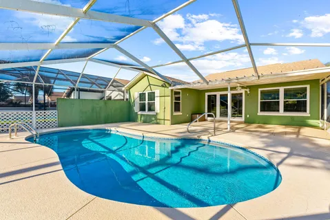 a view of a swimming pool with a patio