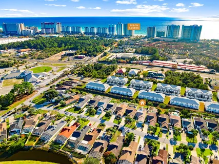 a view of a swimming pool with outdoor seating and a patio