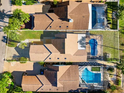 an aerial view of houses with outdoor space