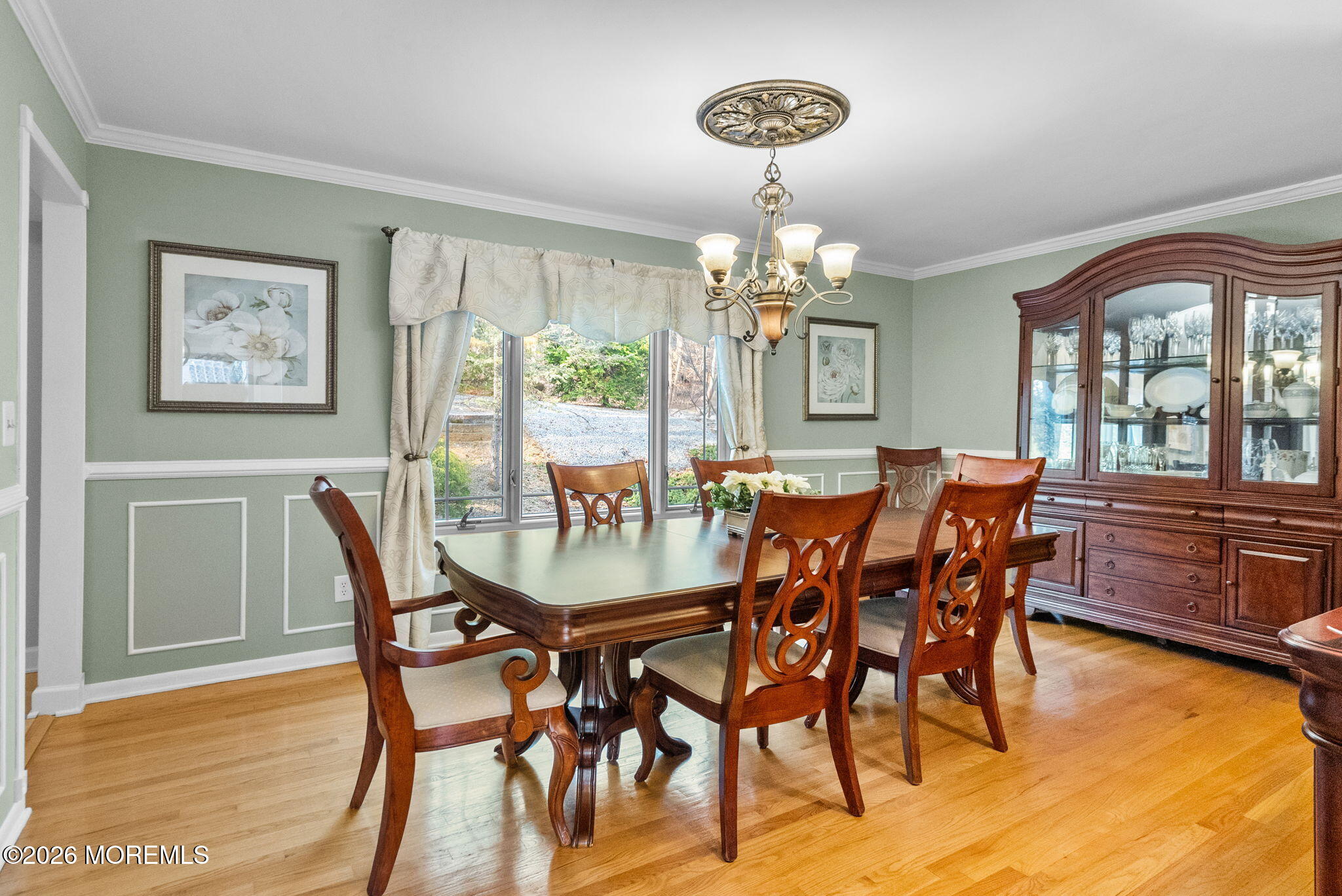 21 Stoney Brook Road Holmdel, NJ 07733 - Photo 10 of 40 a view of a dining room with furniture a chandelier and wooden floor