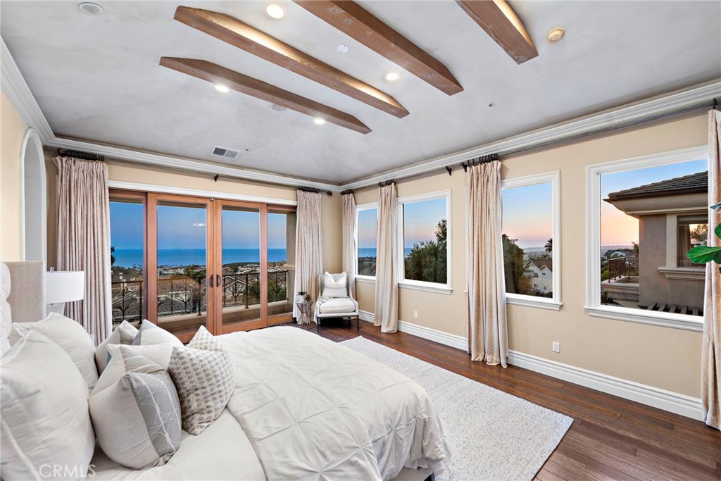 2009 Via Teca San Clemente, CA 92673 - Photo 29 of 52 a bedroom with furniture and large windows