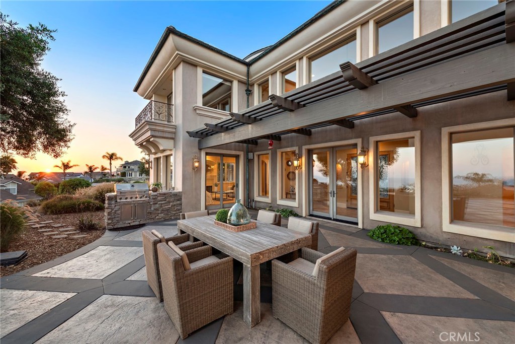 2009 Via Teca San Clemente, CA 92673 - Photo 7 of 52 a view of a patio with couches table and chairs and potted plants