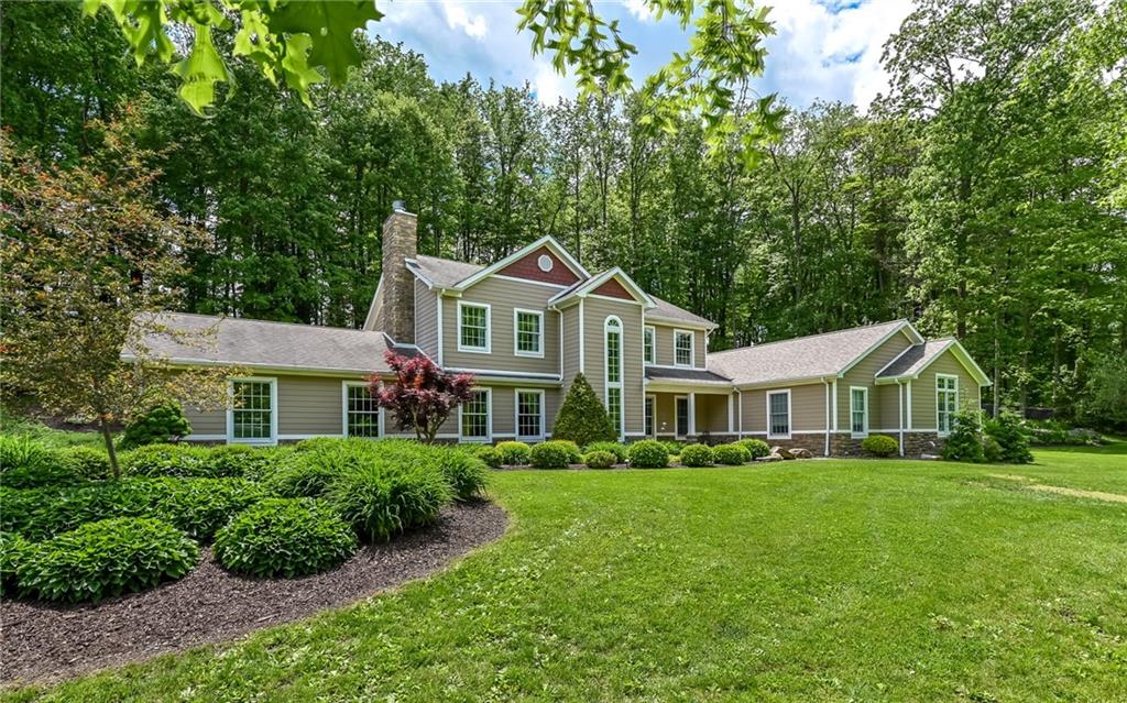 133 Miller Road Sarver, PA 16055 - Photo 1 of 50 a front view of a house with a yard table and chairs